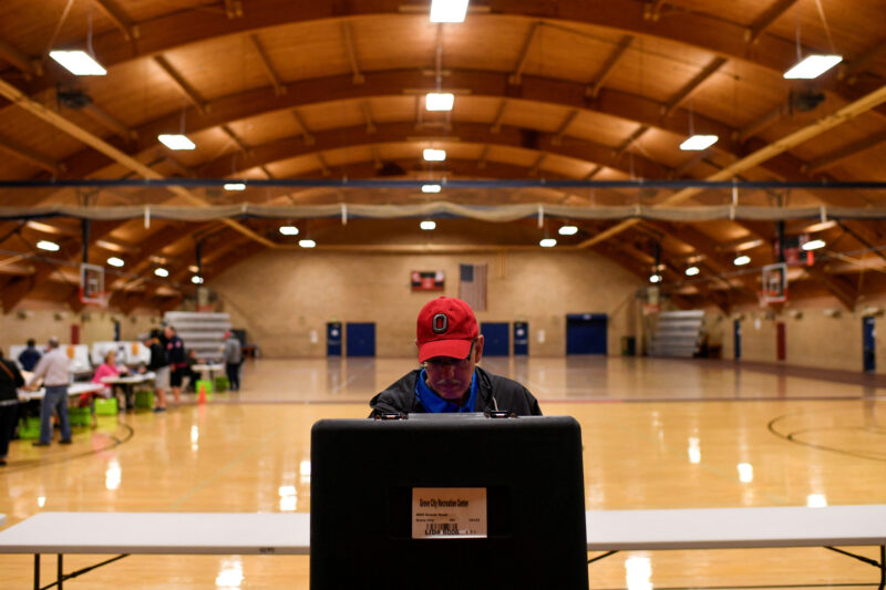 A voter casts his ballot for the midterm primary election in Grove City, Ohio